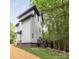 Modern home exterior featuring clean lines, lush landscaping, and a spacious backyard at 1847 Vinton St, Charlotte, NC 28216