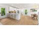 Bright kitchen features a breakfast bar, modern appliances, access to a deck, and an adjacent dining area at 1847 Vinton St, Charlotte, NC 28216