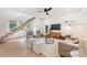 Stylish living room with hardwood floors, modern decor, and an open staircase design at 1847 Vinton St, Charlotte, NC 28216
