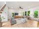 Bright living room features hardwood floors, recessed lighting, large windows, and modern furnishings at 1847 Vinton St, Charlotte, NC 28216