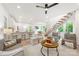 Bright living space with white walls, hardwood floors, modern furnishings, and an open staircase at 1847 Vinton St, Charlotte, NC 28216