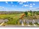 View of a home in a neighborhood with landscaped yards and surrounded by a golf course at 194 Canada Dr, Statesville, NC 28677