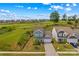 Aerial view of a well-maintained home backing onto a lush golf course in a serene neighborhood at 194 Canada Dr, Statesville, NC 28677