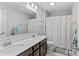 Spacious bathroom with double sinks, a large mirror, and a polka dot shower curtain adding a playful touch at 194 Canada Dr, Statesville, NC 28677