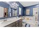 Bathroom featuring double vanity, soaking tub, and elegant decor at 194 Canada Dr, Statesville, NC 28677