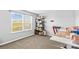 Bright room featuring a large window, a desk, and shelving, ideal for a playroom or hobby area at 194 Canada Dr, Statesville, NC 28677