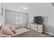 Comfortable bedroom with a daybed, TV, and a window with natural light, creating a relaxing atmosphere at 194 Canada Dr, Statesville, NC 28677