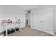 Versatile room with a desk setup, neutral walls, and double doors for multiple uses, like an office or bedroom at 194 Canada Dr, Statesville, NC 28677