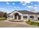 Exterior aerial view of community clubhouse with black shutters, a grand entrance, and surrounding landscaping at 194 Canada Dr, Statesville, NC 28677