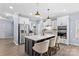 Bright kitchen features a large center island, stainless steel appliances, and white cabinetry at 194 Canada Dr, Statesville, NC 28677