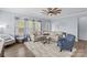 Cozy living room with large windows, modern furnishings, and neutral tones at 194 Canada Dr, Statesville, NC 28677