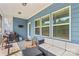 Inviting covered patio with comfortable seating, a floral rug, and a grill, perfect for outdoor entertaining at 194 Canada Dr, Statesville, NC 28677