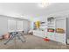 Bright playroom featuring white built-in shelving and plenty of space for activities at 194 Canada Dr, Statesville, NC 28677