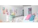 Bright bedroom with a four-poster bed, patterned linens, and ample wall decor at 201 Giant Oak Ave, Statesville, NC 28677
