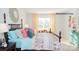 Bright bedroom featuring a four-poster bed, colorful bedding, and sunny window with patterned curtains at 201 Giant Oak Ave, Statesville, NC 28677