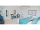 Bright bedroom showcases neutral walls, plush carpet, two chairs and ensuite bathroom at 201 Giant Oak Ave, Statesville, NC 28677