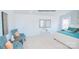 Bright main bedroom with sitting area features neutral walls, plush carpet and white paneled doors at 201 Giant Oak Ave, Statesville, NC 28677