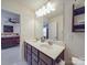 Bathroom featuring double sinks, a large mirror, and an adjacent bedroom at 2037 Christopher Wood Ct, Indian Land, SC 29707