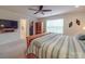 Well-lit bedroom featuring a ceiling fan, area rug, a closet, a large window, and a TV at 2037 Christopher Wood Ct, Indian Land, SC 29707