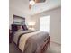 Comfortable bedroom featuring ceiling fan, neutral decor, and natural light from the window at 2037 Christopher Wood Ct, Indian Land, SC 29707
