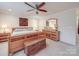 Bedroom is decorated with ceiling fan, area rug, a dresser with mirror, and a large window at 2037 Christopher Wood Ct, Indian Land, SC 29707