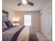Comfortable bedroom with a ceiling fan, double closet, and a well-lit, inviting ambiance, perfect for rest and relaxation at 2037 Christopher Wood Ct, Indian Land, SC 29707