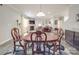 A dining room with a fireplace and a brown leather sofa at 2037 Christopher Wood Ct, Indian Land, SC 29707