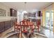 Dining area with hardwood floors, dark cabinets, and stainless steel appliances at 2037 Christopher Wood Ct, Indian Land, SC 29707