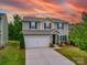 Charming two-story home with a well-maintained lawn, a two-car garage, and a cozy front porch at 2037 Christopher Wood Ct, Indian Land, SC 29707