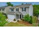 Inviting two-story home with a manicured lawn, two-car garage, and attractive landscaping at 2037 Christopher Wood Ct, Indian Land, SC 29707