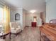 Inviting living room featuring hardwood floors and open entryway and natural light from a large window at 2037 Christopher Wood Ct, Indian Land, SC 29707