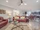 Spacious living room with hardwood floors, modern lighting, and a connected dining area at 2037 Christopher Wood Ct, Indian Land, SC 29707