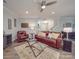 Cozy living room with hardwood floors, leather furniture, and decorative accents at 2037 Christopher Wood Ct, Indian Land, SC 29707