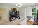 Cozy bedroom with plush seating, a built-in media center, and a window with natural light at 21300 Crown Lake Dr, Cornelius, NC 28031