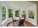 Charming breakfast nook with a round table set, surrounded by bright windows offering abundant natural light at 21300 Crown Lake Dr, Cornelius, NC 28031