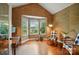 Cozy office space with natural light, hardwood floors, and stylish decor with a view of the garden at 21300 Crown Lake Dr, Cornelius, NC 28031