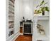 A butler's pantry features many storage shelves and small refrigerator for wine or other beverages at 21300 Crown Lake Dr, Cornelius, NC 28031