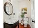Stylish powder room features a modern vanity and fixtures, complemented by decorative art and charming accents at 21300 Crown Lake Dr, Cornelius, NC 28031