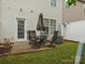 Home with concrete patio, table and chairs, small backyard with partial fence, and exterior siding at 2137 Midnight Blue Ln, Fort Mill, SC 29708