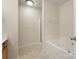 Neutral bathroom has a large soaking tub and separate shower with tile flooring at 2137 Midnight Blue Ln, Fort Mill, SC 29708