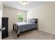 Bedroom with a window, neutral walls and carpet and a black dresser and bedframe at 2137 Midnight Blue Ln, Fort Mill, SC 29708