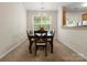 Open-concept dining room with natural light and a view into the kitchen at 2137 Midnight Blue Ln, Fort Mill, SC 29708