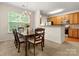Dining area adjacent to the kitchen, with a window providing natural light at 2137 Midnight Blue Ln, Fort Mill, SC 29708