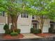 Charming townhome featuring a stone facade, lush landscaping, and a convenient one-car garage at 2137 Midnight Blue Ln, Fort Mill, SC 29708
