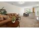 Open living room and dining area, with hardwood floors and bright windows at 2137 Midnight Blue Ln, Fort Mill, SC 29708