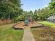 Community playground area with a slide, swing set, bench, and walking path at 2137 Midnight Blue Ln, Fort Mill, SC 29708