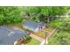 Aerial view of home showcasing its blue exterior, roof, and surrounding greenery at 218 5Th Se St, Hickory, NC 28602