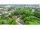 Aerial perspective showcasing home in a neighborhood, surrounded by green trees and other homes at 218 5Th Se St, Hickory, NC 28602