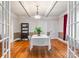 Elegant dining room features a white tablecloth, and an open doorway into the living room at 218 5Th Se St, Hickory, NC 28602