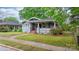Charming home exterior with a well-manicured lawn, mature trees, and a welcoming front porch at 218 5Th Se St, Hickory, NC 28602